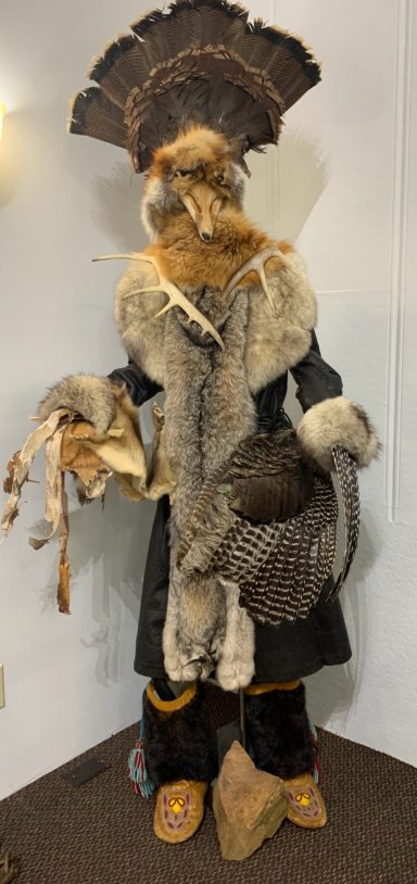 7 foot tall shaman of fur, feather, and horns