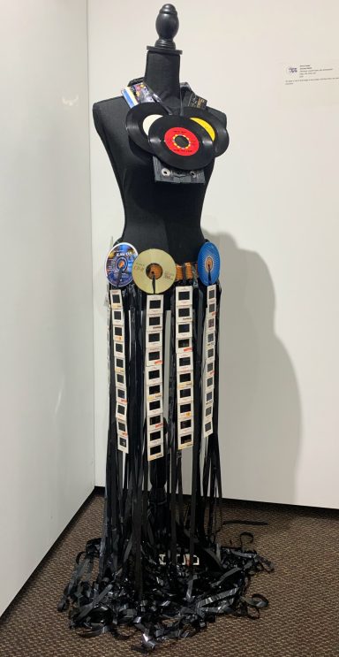 Gown made of videotape, photo slides, record albums, CDs